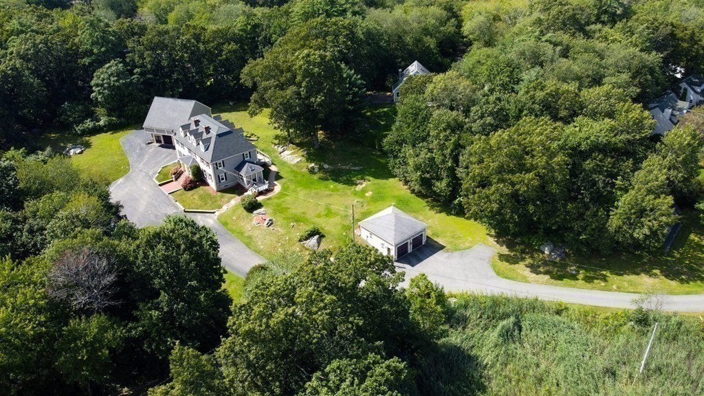 39 Middle Road, Unit A Newbury, MA 01951 - Photo 38 of 40 an aerial view of a house with a yard and swimming pool outdoor seating