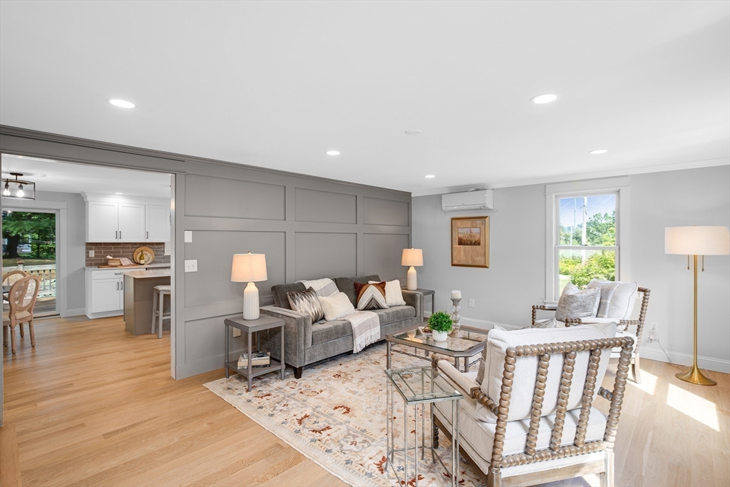 39 Middle Road, Unit A Newbury, MA 01951 - Photo 7 of 40 a living room with furniture and a wooden floor