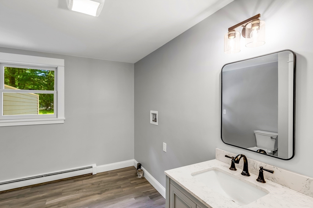 39 Middle Road, Unit A Newbury, MA 01951 - Photo 10 of 40 a bathroom with a sink and a mirror