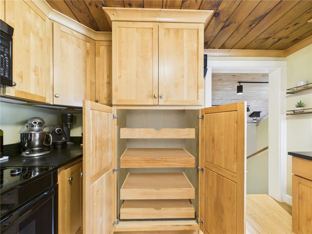 95 Mail Road Exeter, RI 02822 - Photo 15 of 33 Pantry cupboard pullout shelving makes putting shopping away a breeze. To the far right is a glimpse of the entrance to the FR.
