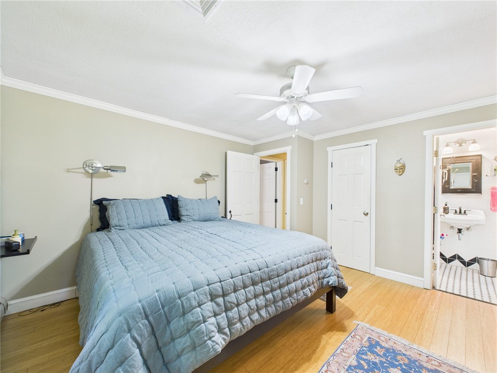 95 Mail Road Exeter, RI 02822 - Photo 20 of 33 Another view of the Master suite with a glimpse into the private half bath with a crisp black & white color scheme, ceramic tile floor, and a bit of decorative whimsy you'll note when you visit.