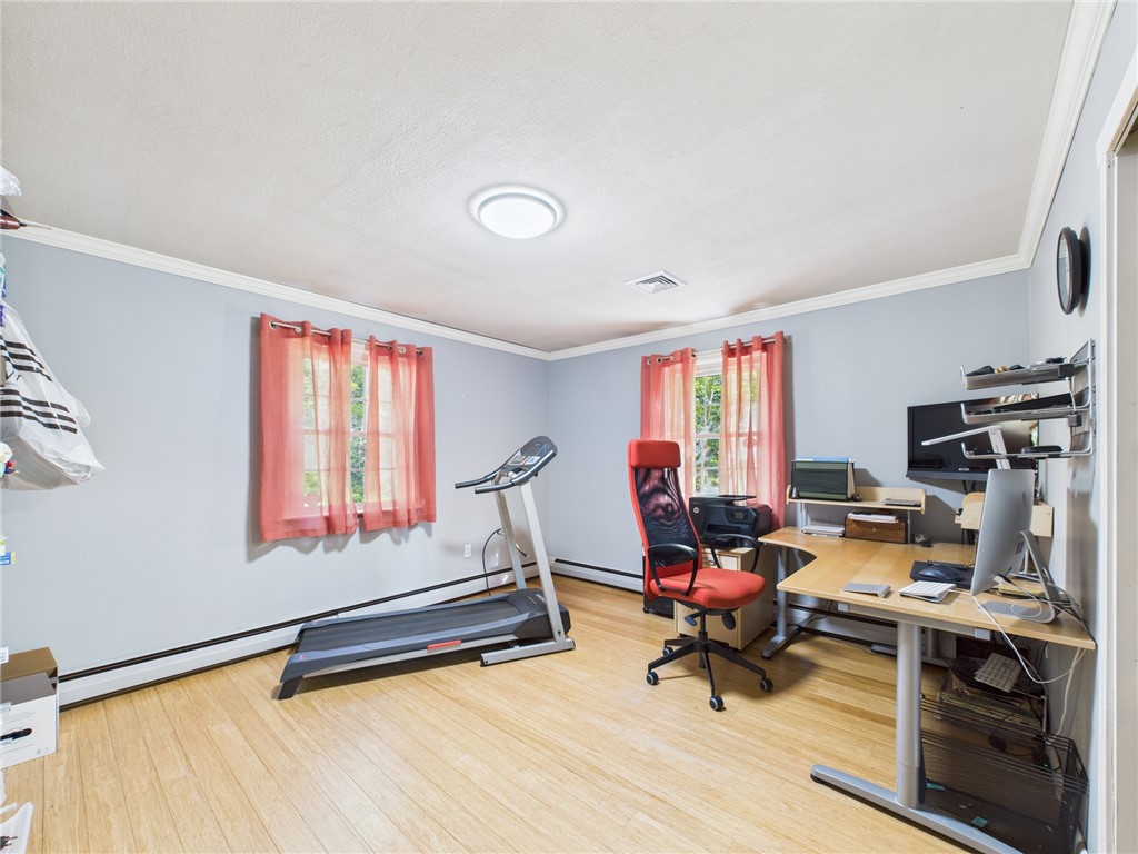 95 Mail Road Exeter, RI 02822 - Photo 22 of 33 2nd Bedroom has morphed into an office/exercise room for these longtime empty nesters. There is a whole house fan in the bedroom hallway besides the Central Air throughout the home.