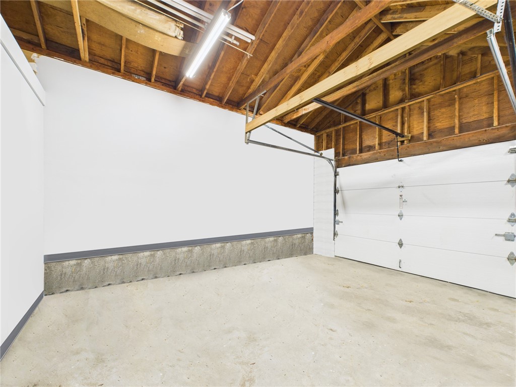 95 Mail Road Exeter, RI 02822 - Photo 28 of 33 The 418sf garage hides the FR from the street view of the home. It was designed to store lawn equipment/shed contents, besides vehicles i.e., a car. Depending on your preference and the size of your vehicles, you can fit 2 cars in this 1.5 car space.