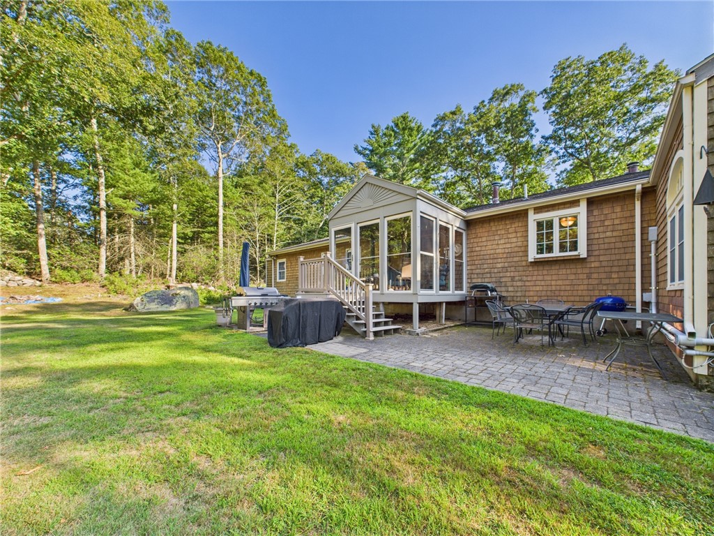 95 Mail Road Exeter, RI 02822 - Photo 31 of 33 Another view. From the rear view, the left side of the house holds the PROPANE TANK (which is PIPED into the GRILLand WHOLE HOUSE GENERATOR), the 6 YEAR OLD WHOLE HSE GENERATOR, and the 8YR A/C CONDENSER. The pristine unfinished basement in this house has a 20 yr forced water baseboard heating system w/a NEW BECKET BURNER. There is a supplemental HEAT PUMP. A state-of-art EUROPEAN made DEHUMIDIFIER in the LL which makes for a fresh and dry ENVIRONMENT, PERFECT FOR FINISHING (& wine making!).