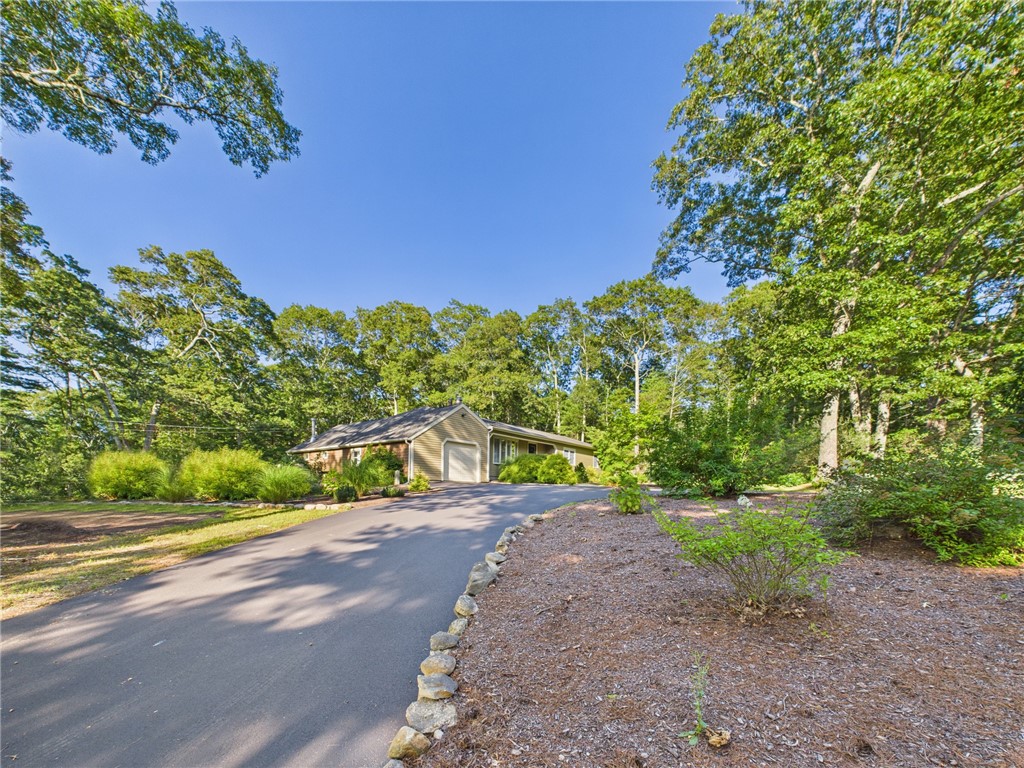 95 Mail Road Exeter, RI 02822 - Photo 33 of 33 View of side of house from driveway that branches off from main driveway. Besides providing additional parking for very large gatherings, this paved arm can be used for accessing or exiting the main driveway that runs straight off Mail Rd to Garage door.