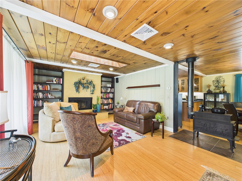 95 Mail Road Exeter, RI 02822 - Photo 7 of 33 An expanded view taken from the front door which shows the creme de la creme embossed "Jotul" woodstove, adding to the coziness on snowy nights.