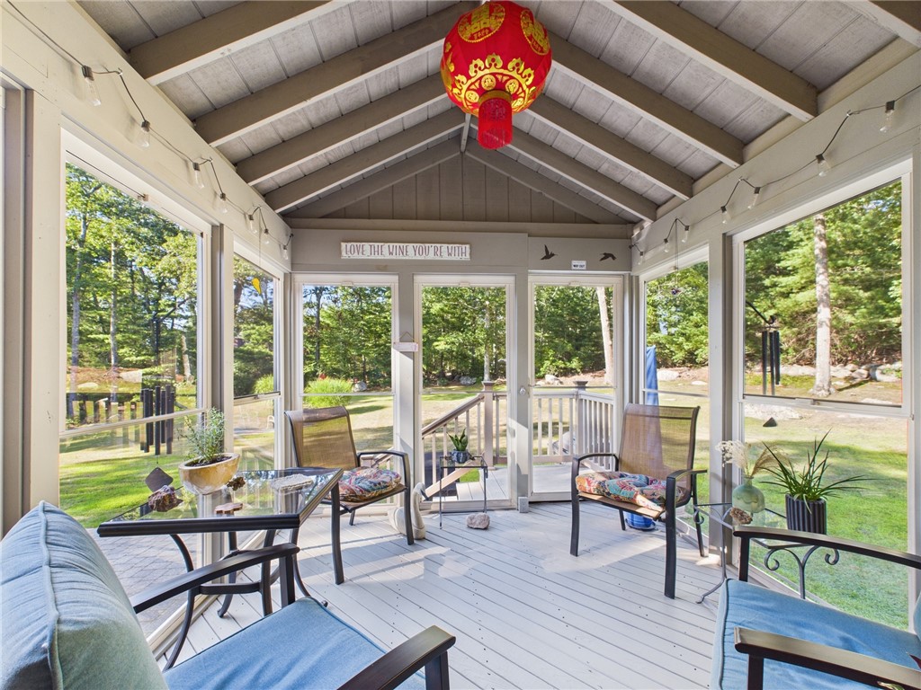 95 Mail Road Exeter, RI 02822 - Photo 10 of 33 The screened porch easily converts into a sunroom as it's walled by juxtaposed screened doors. Merely pull up the hideaway glass panels... and, voila! You have a glass lined, vaulted sunroom! An exceptional addition to this home, allowing a panoramic view of manicured greenery.
