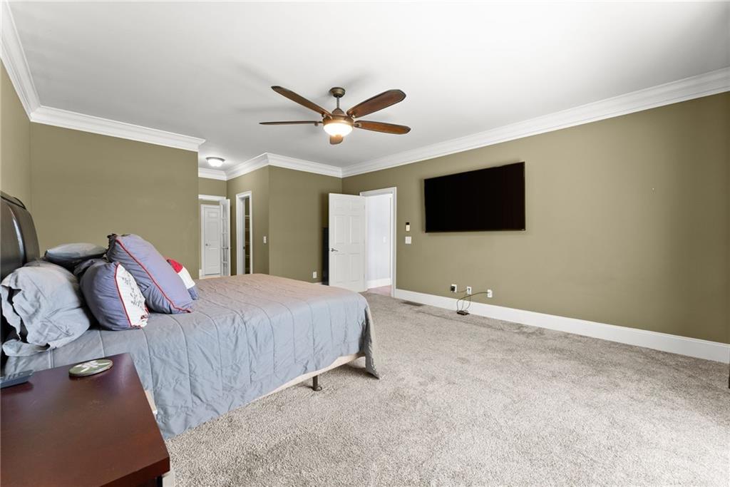 6643 Windvane Point Clermont, GA 30527 - Photo 26 of 88 a living room with furniture and a flat screen tv