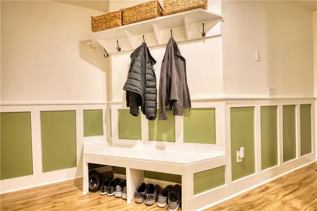 a bathroom with a tub and a potted plant