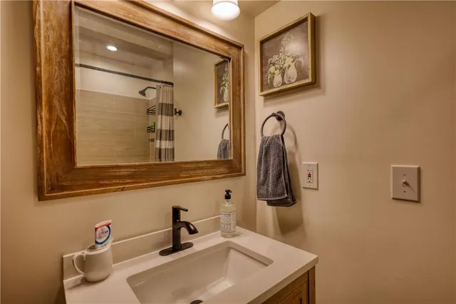 a view of empty room with wooden floor and cabinet