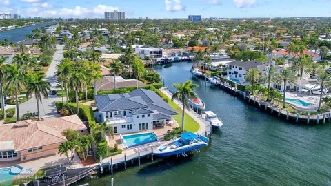 an aerial view of a house with a ocean view