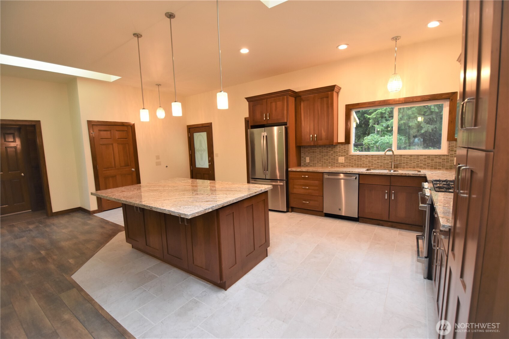 30331 Heimer Road Arlington, WA 98223 - Photo 21 of 37 a kitchen with stainless steel appliances granite countertop a sink a stove and a refrigerator
