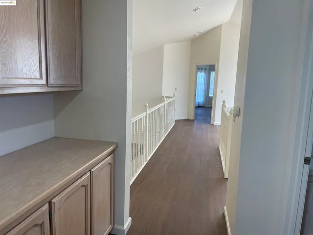 a view of a kitchen from the hallway
