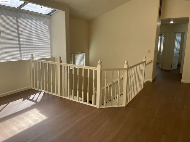 a view of a balcony with wooden floor