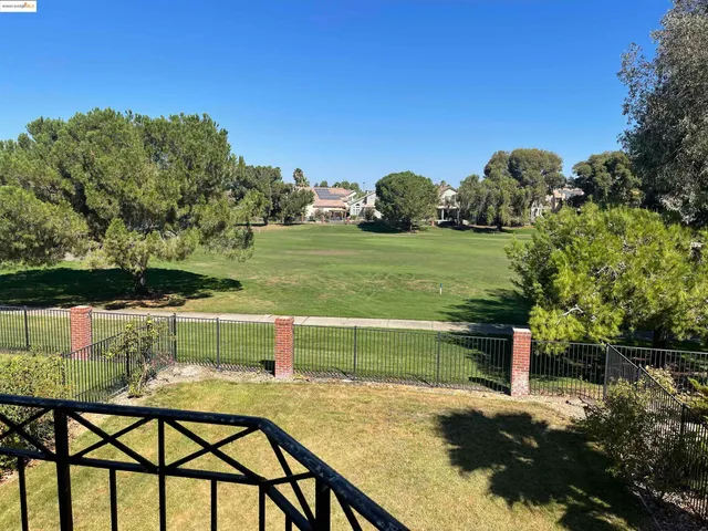 a view of a lake with a yard