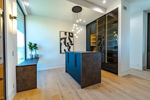 a living room with furniture and potted plant