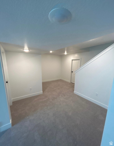 2818 West Aurora Avenue Mapleton, UT 84664 - Photo 6 of 9 Finished below grade area featuring baseboards and dark carpet