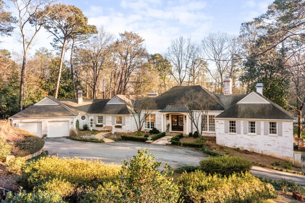 2660 West Wesley Road Northwest Atlanta, GA 30327 - Photo 1 of 1 a front view of a house with a yard