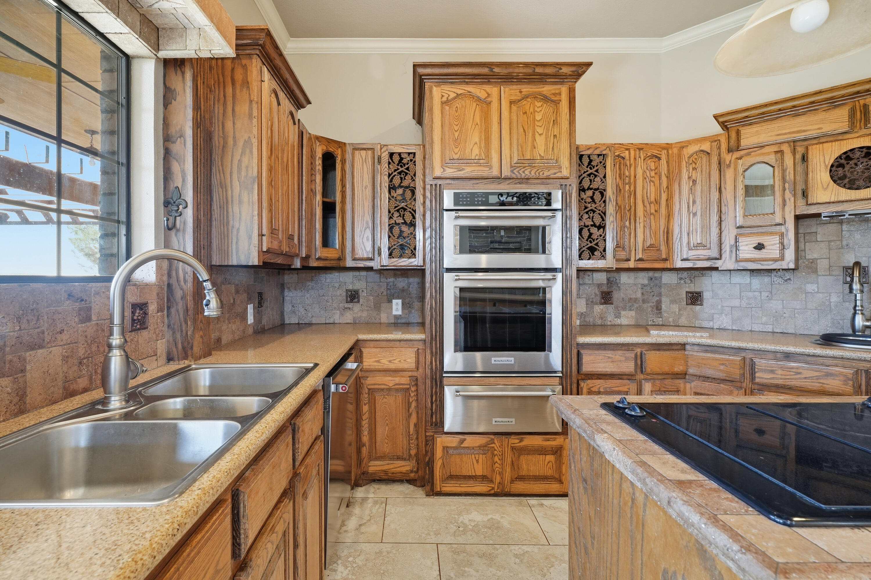 5601 County Road 7920 Lubbock, TX 79424 - Photo 11 of 68 a kitchen with stainless steel appliances granite countertop a sink stove and refrigerator