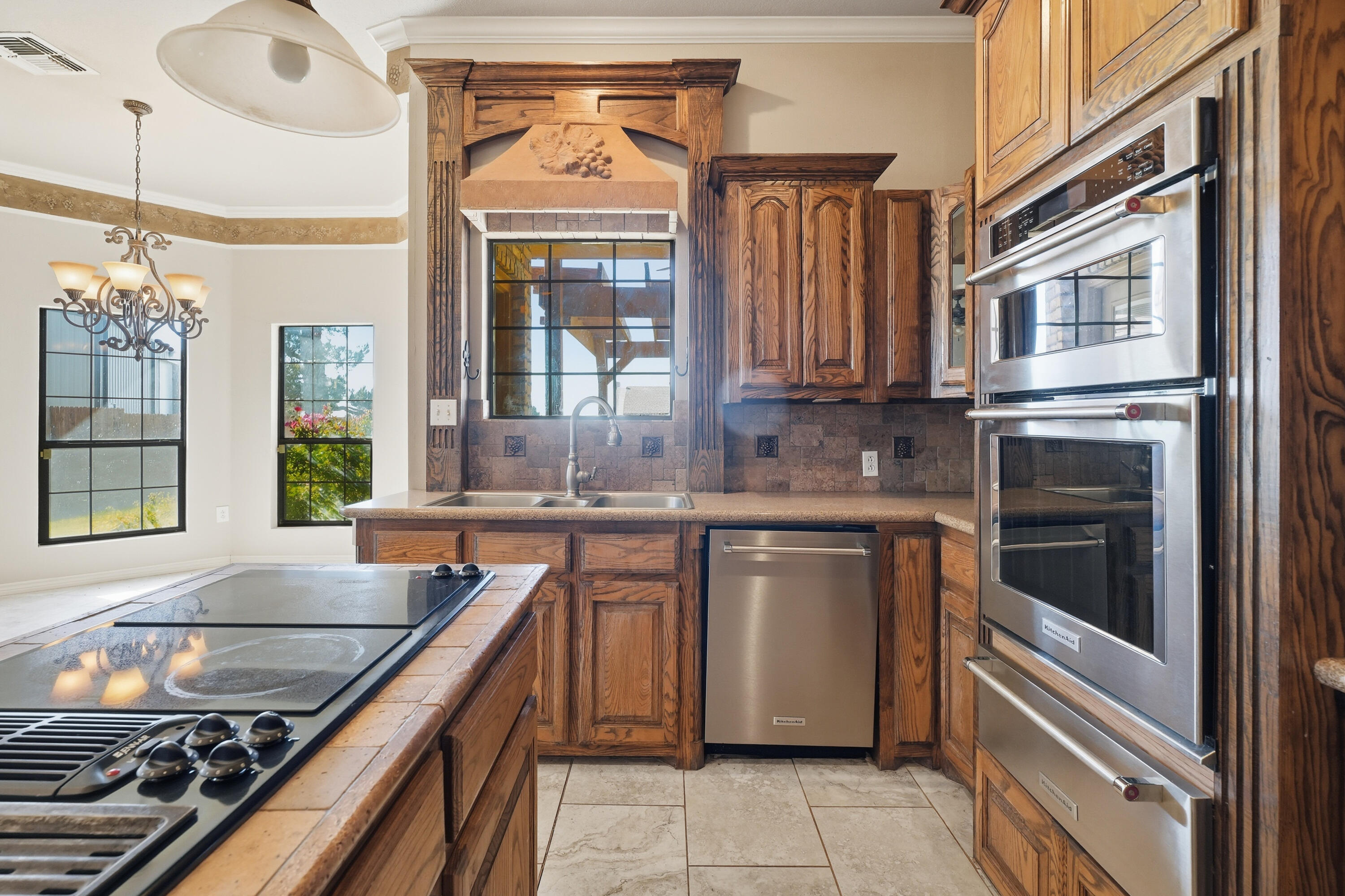 5601 County Road 7920 Lubbock, TX 79424 - Photo 12 of 68 a kitchen with stainless steel appliances granite countertop a stove and a sink