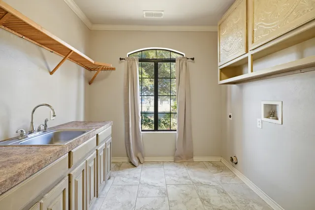 a view of a livingroom with furniture wooden floor and windows