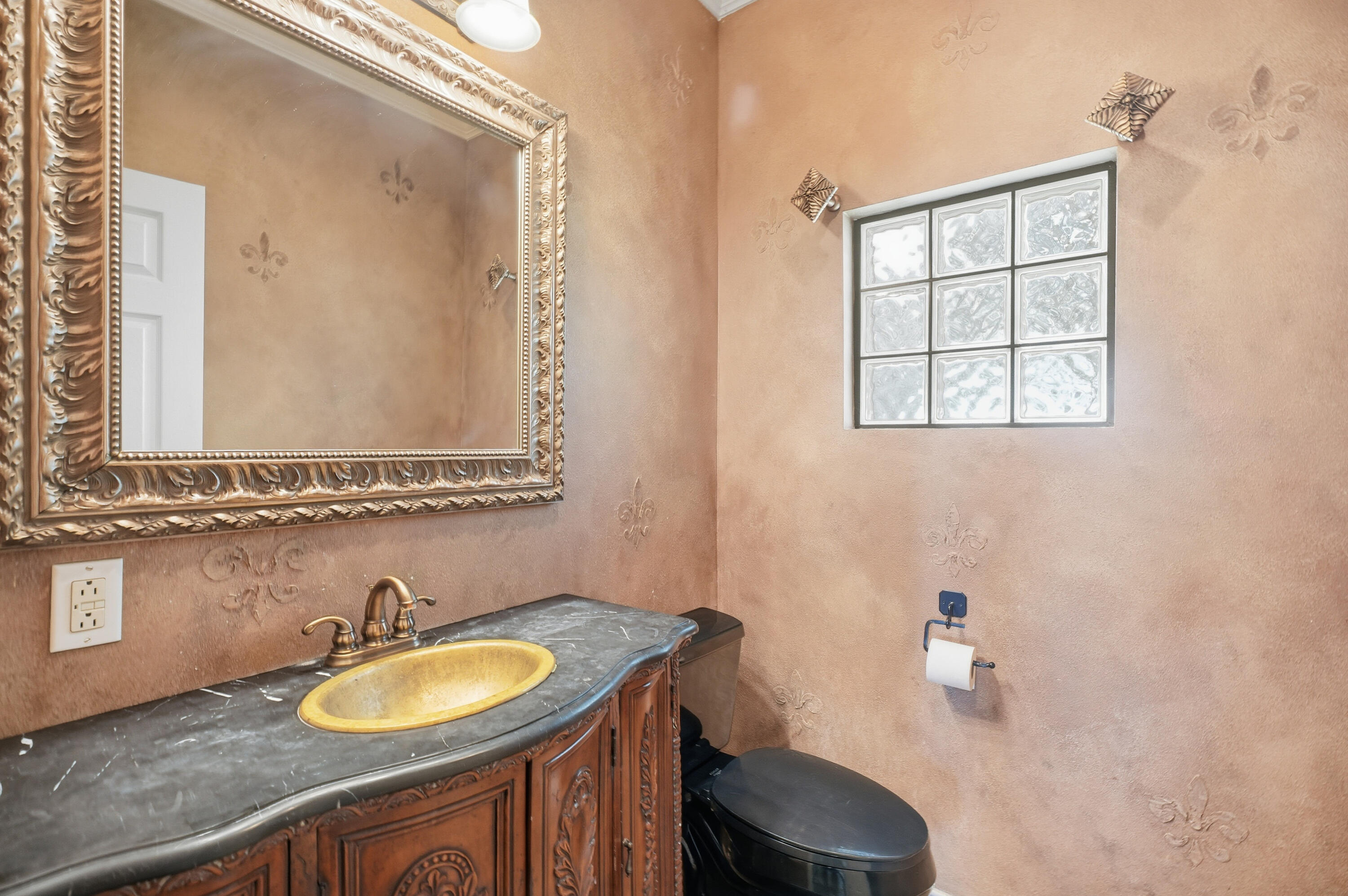 5601 County Road 7920 Lubbock, TX 79424 - Photo 16 of 68 a bathroom with a granite countertop sink and a mirror