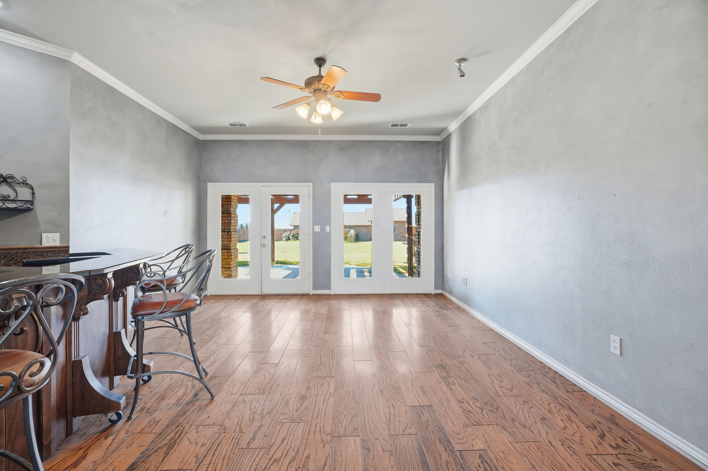 5601 County Road 7920 Lubbock, TX 79424 - Photo 19 of 68 a view of a livingroom with furniture wooden floor and windows
