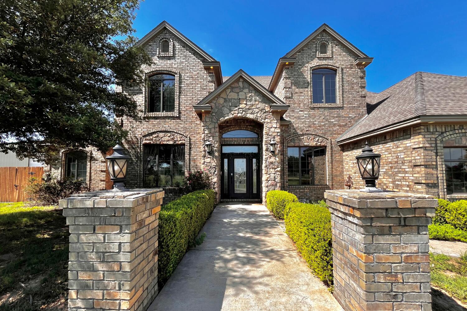 5601 County Road 7920 Lubbock, TX 79424 - Photo 2 of 68 a front view of a house with a yard