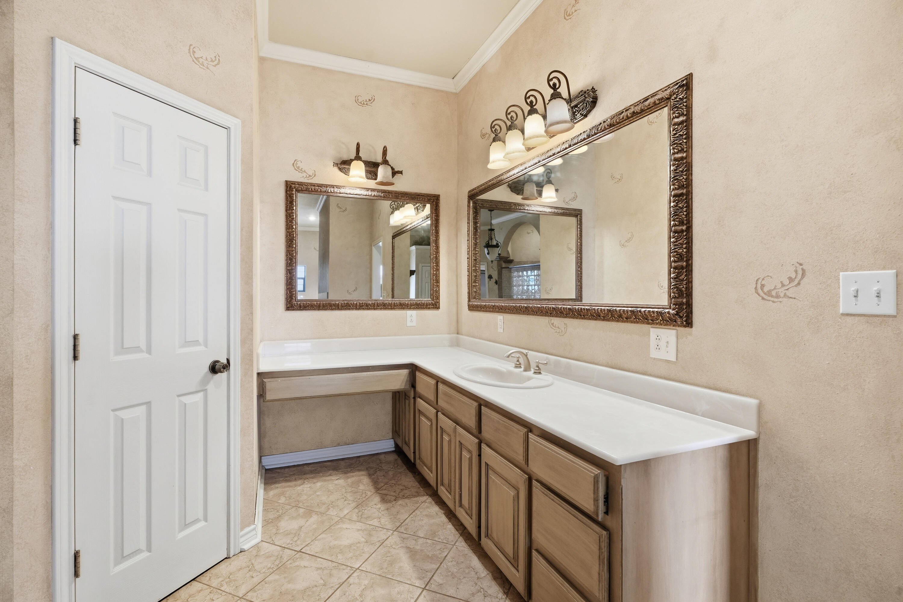 5601 County Road 7920 Lubbock, TX 79424 - Photo 24 of 68 a bathroom with a sink and a mirror