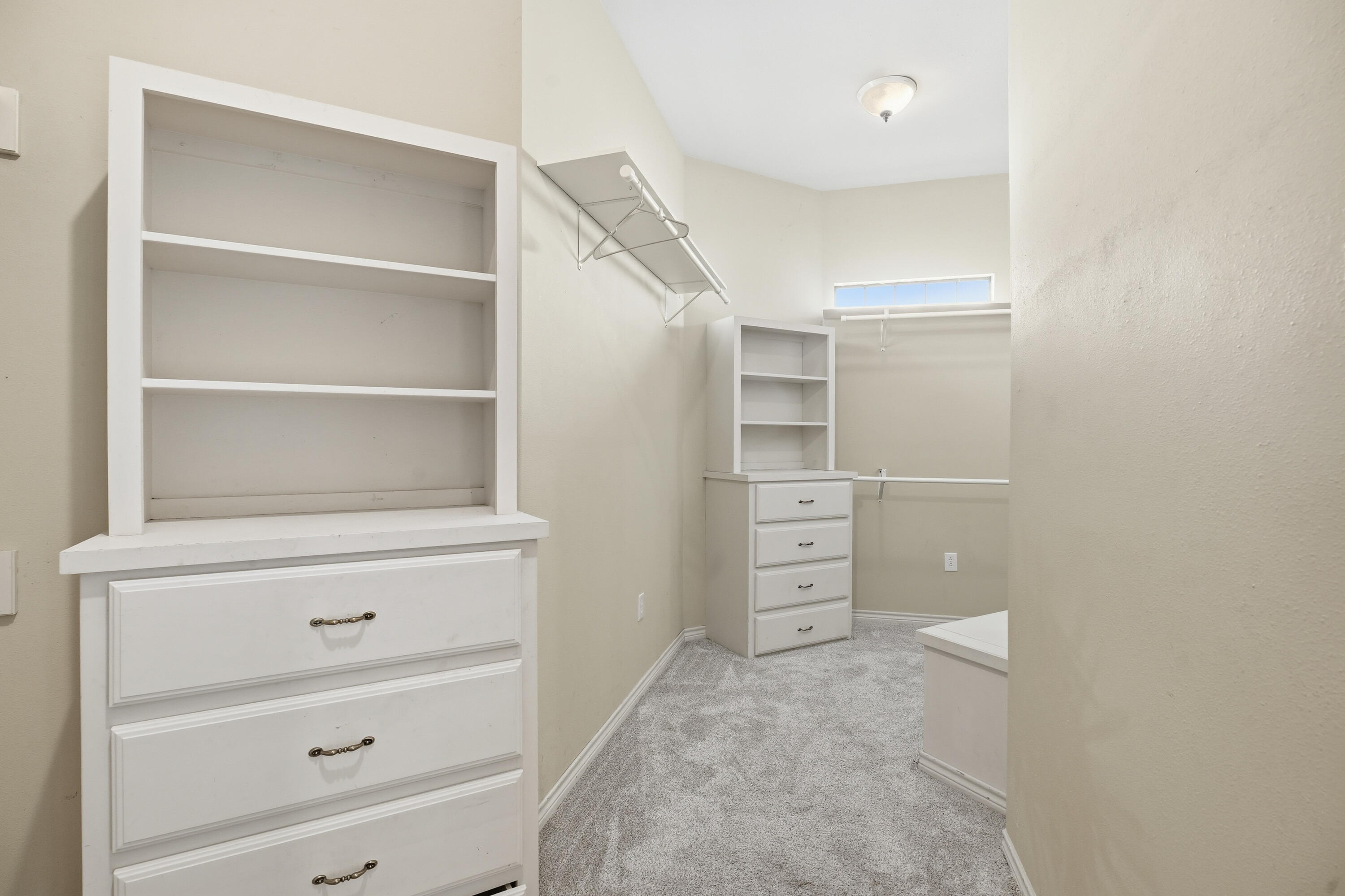 5601 County Road 7920 Lubbock, TX 79424 - Photo 27 of 68 a view of walk in closet with empty racks