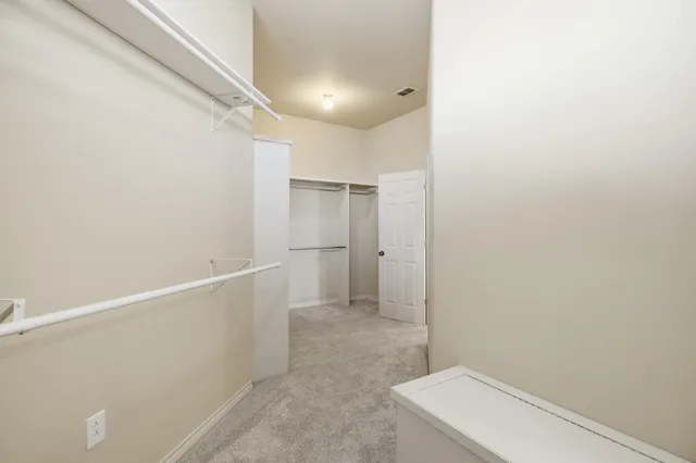 an empty room with view of closet