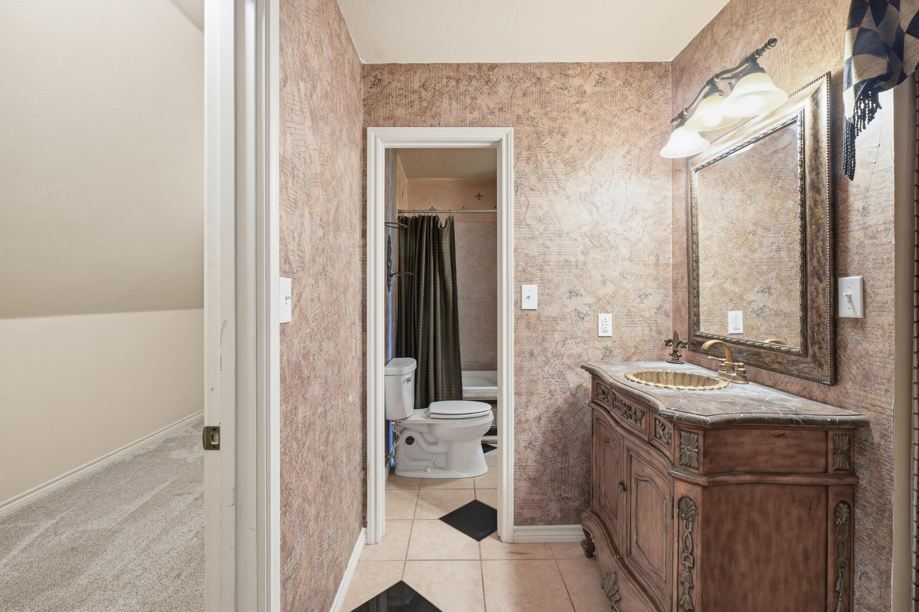 5601 County Road 7920 Lubbock, TX 79424 - Photo 36 of 68 a bathroom with a sink a toilet and shower
