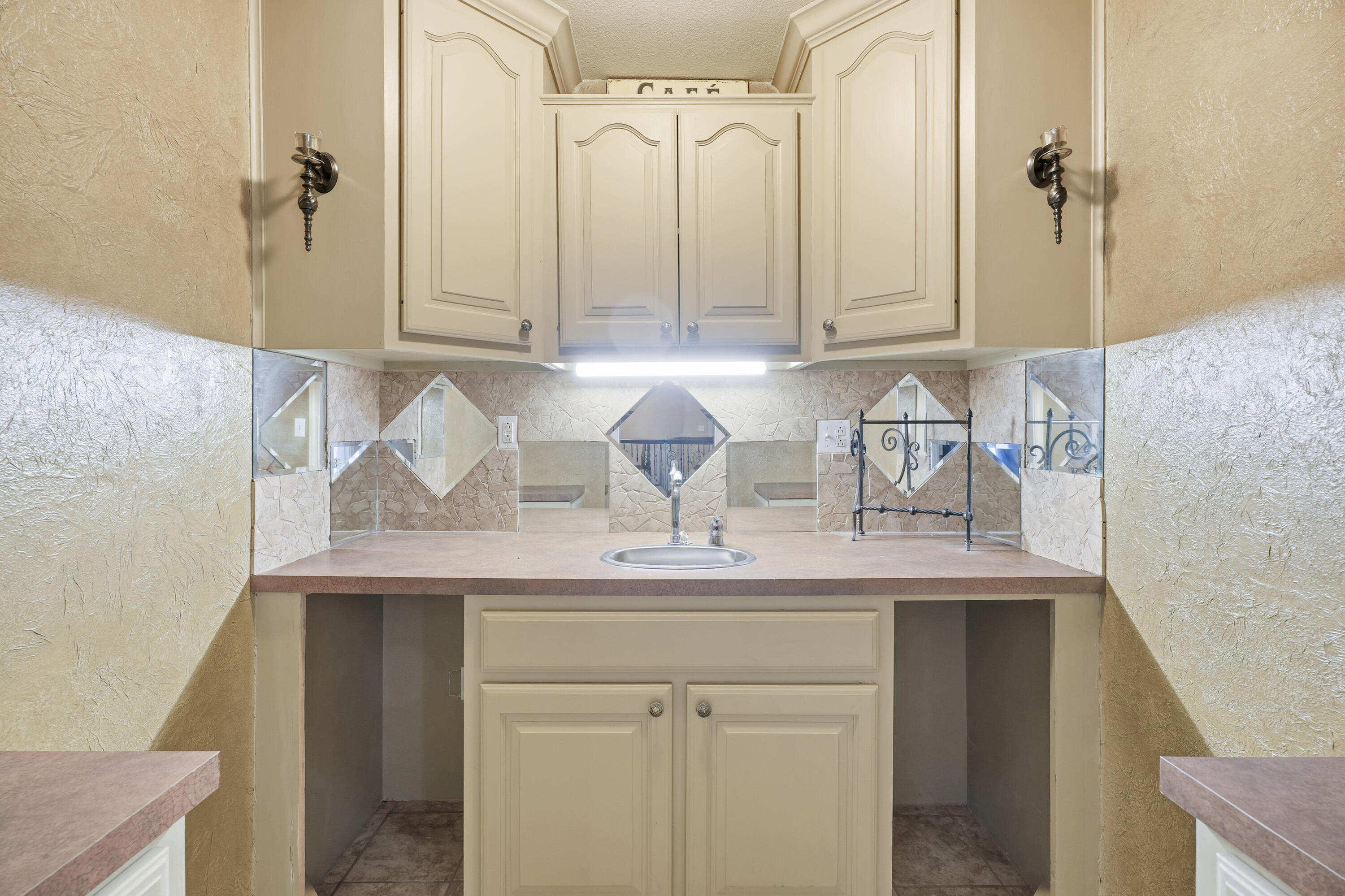 5601 County Road 7920 Lubbock, TX 79424 - Photo 45 of 68 a kitchen with stainless steel appliances white cabinets and a sink