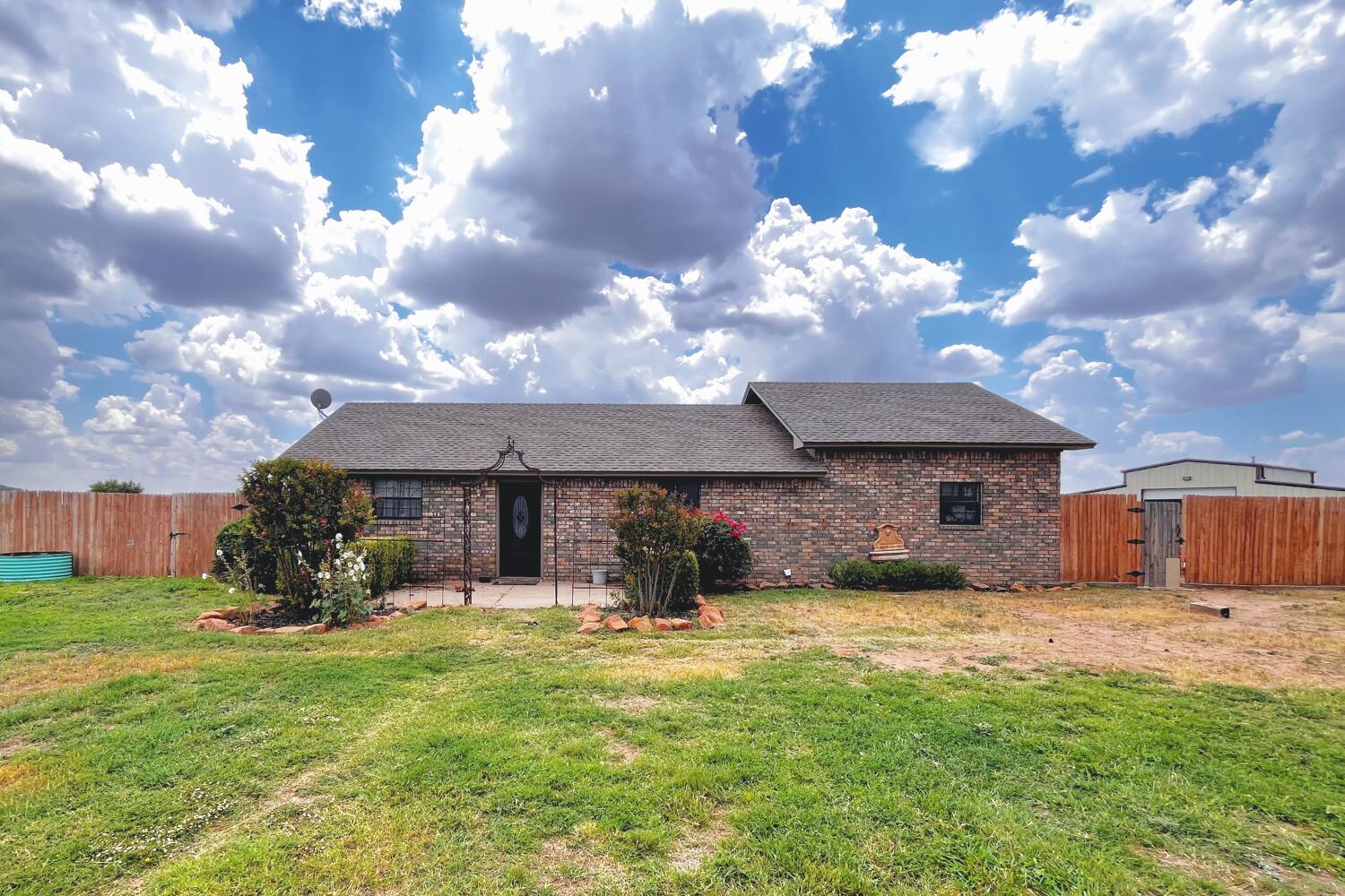 5601 County Road 7920 Lubbock, TX 79424 - Photo 52 of 68 a view of a house with a yard