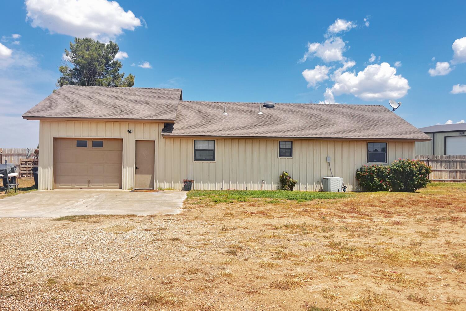5601 County Road 7920 Lubbock, TX 79424 - Photo 60 of 68 a house that has a tree in front of it