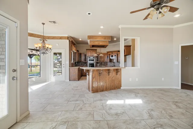 a kitchen with stainless steel appliances granite countertop a stove and a sink