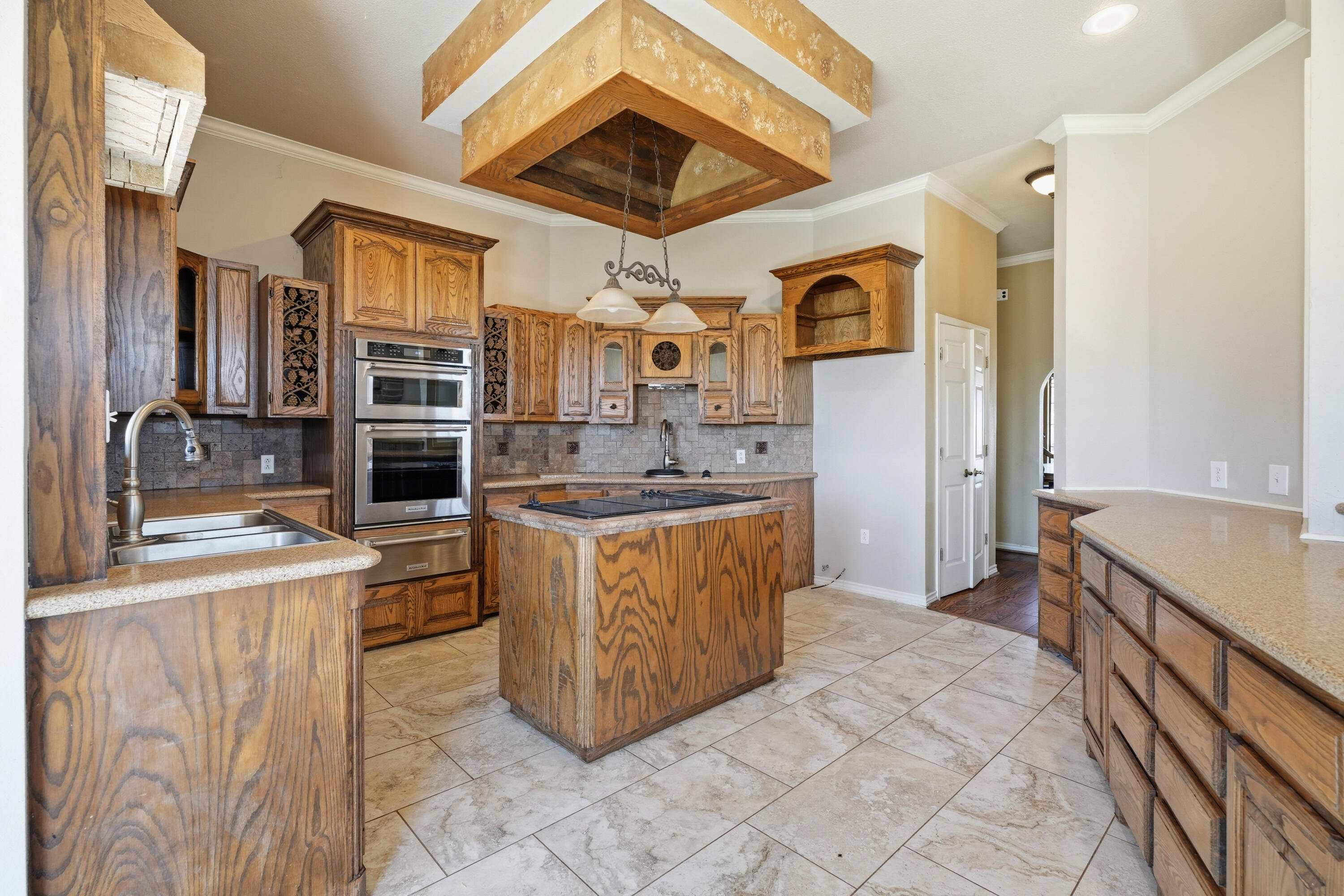 5601 County Road 7920 Lubbock, TX 79424 - Photo 10 of 68 a kitchen with stainless steel appliances granite countertop a sink and cabinets