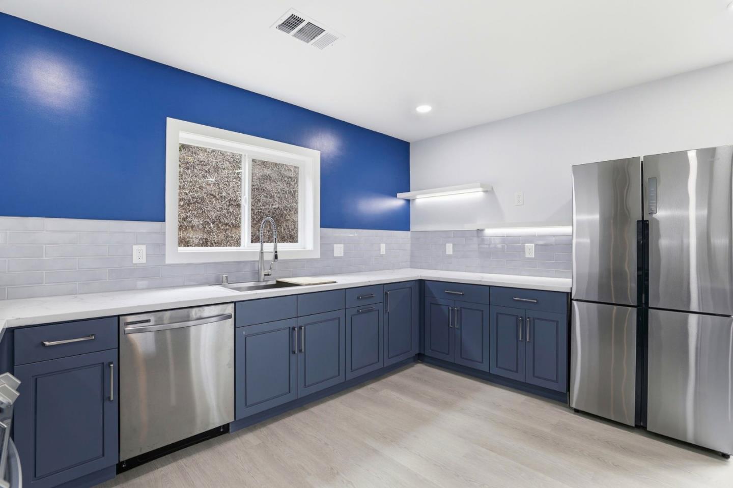 1802 Ponca Court Fremont, CA 94539 - Photo 11 of 28 a kitchen with stainless steel appliances granite countertop a sink stove and refrigerator