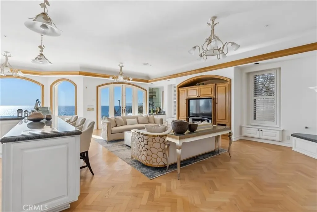 21 Ritz Cove Drive Dana Point, CA 92629 - Photo 14 of 72 a living room with furniture a chandelier and a flat screen tv