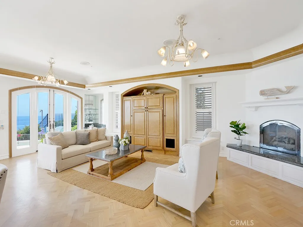 21 Ritz Cove Drive Dana Point, CA 92629 - Photo 17 of 72 a living room with furniture and a chandelier