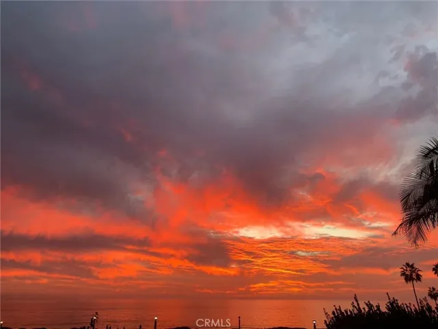 a spacious bedroom with two bed and a large window