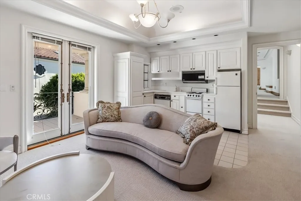 21 Ritz Cove Drive Dana Point, CA 92629 - Photo 46 of 72 a living room with furniture and a large window with kitchen view