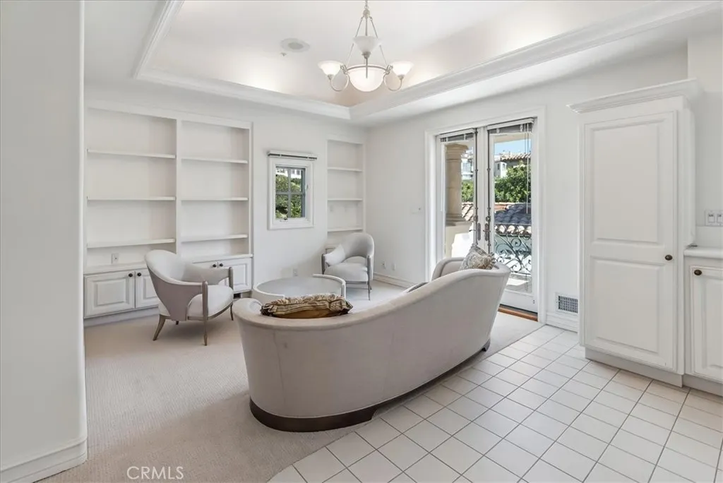 21 Ritz Cove Drive Dana Point, CA 92629 - Photo 47 of 72 a living room with furniture and a chandelier