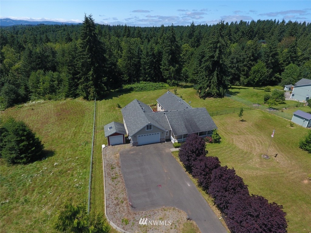 21741 Michigan Hill Road Southwest Rochester, WA 98579 - Photo 2 of 27 an aerial view of a house with pool garden