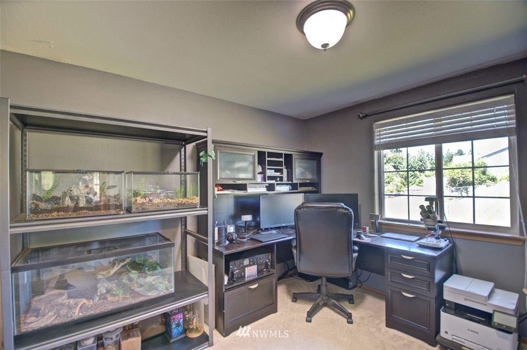 21741 Michigan Hill Road Southwest Rochester, WA 98579 - Photo 14 of 27 a work room with furniture and a window