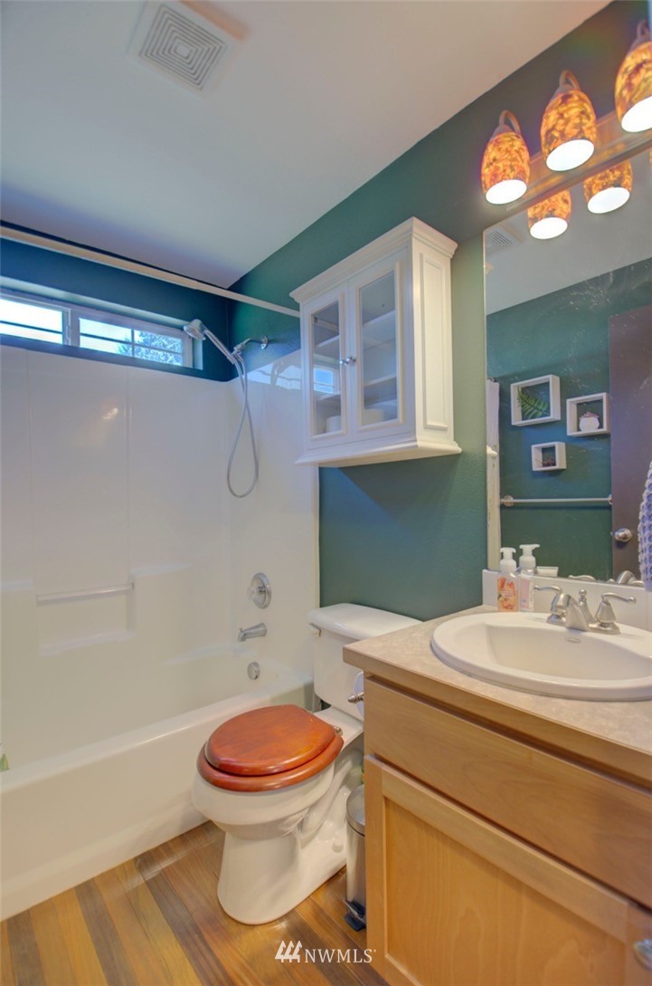 21741 Michigan Hill Road Southwest Rochester, WA 98579 - Photo 15 of 27 a bathroom with a sink a toilet and shower