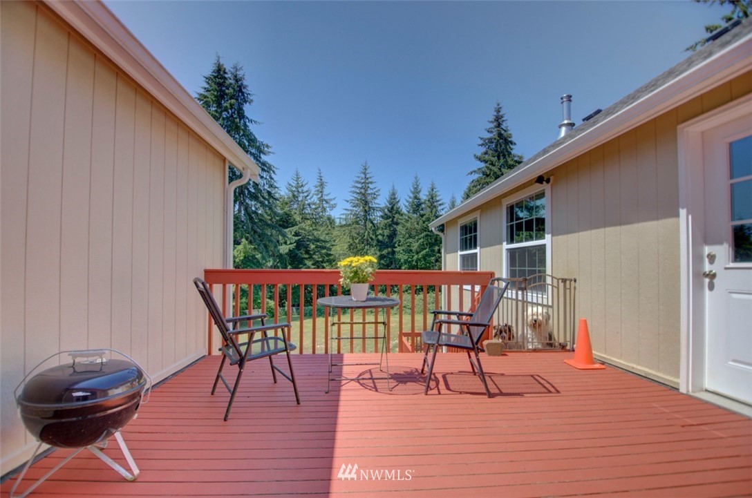 21741 Michigan Hill Road Southwest Rochester, WA 98579 - Photo 17 of 27 a balcony view with a seating space