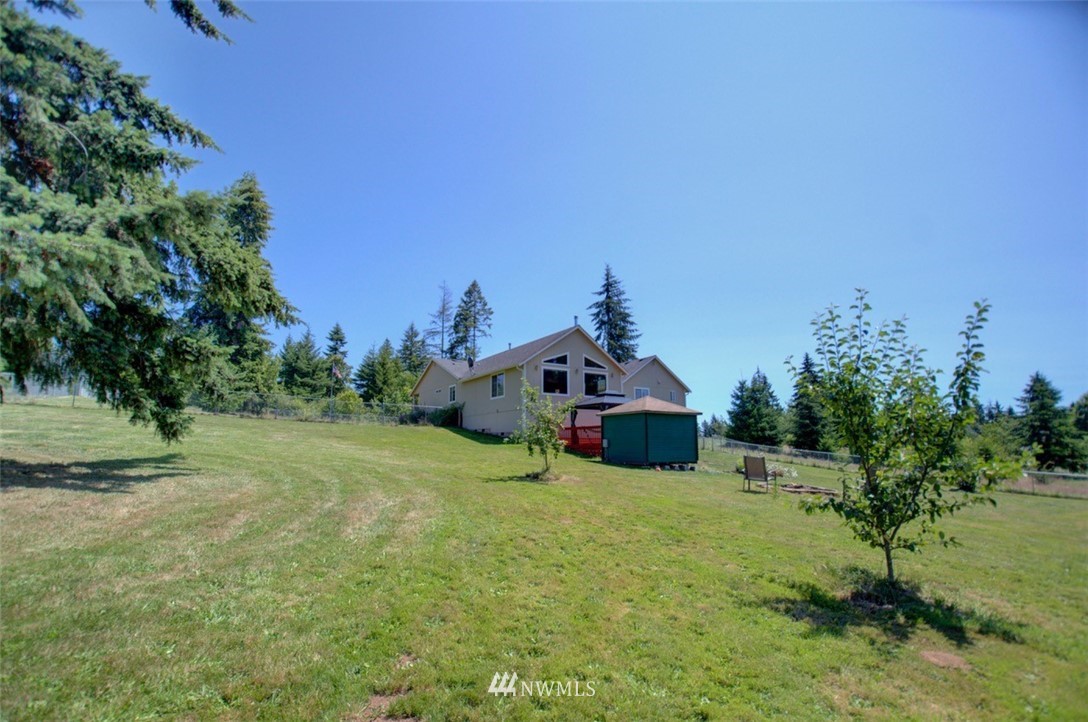 21741 Michigan Hill Road Southwest Rochester, WA 98579 - Photo 23 of 27 a view of a house with a yard