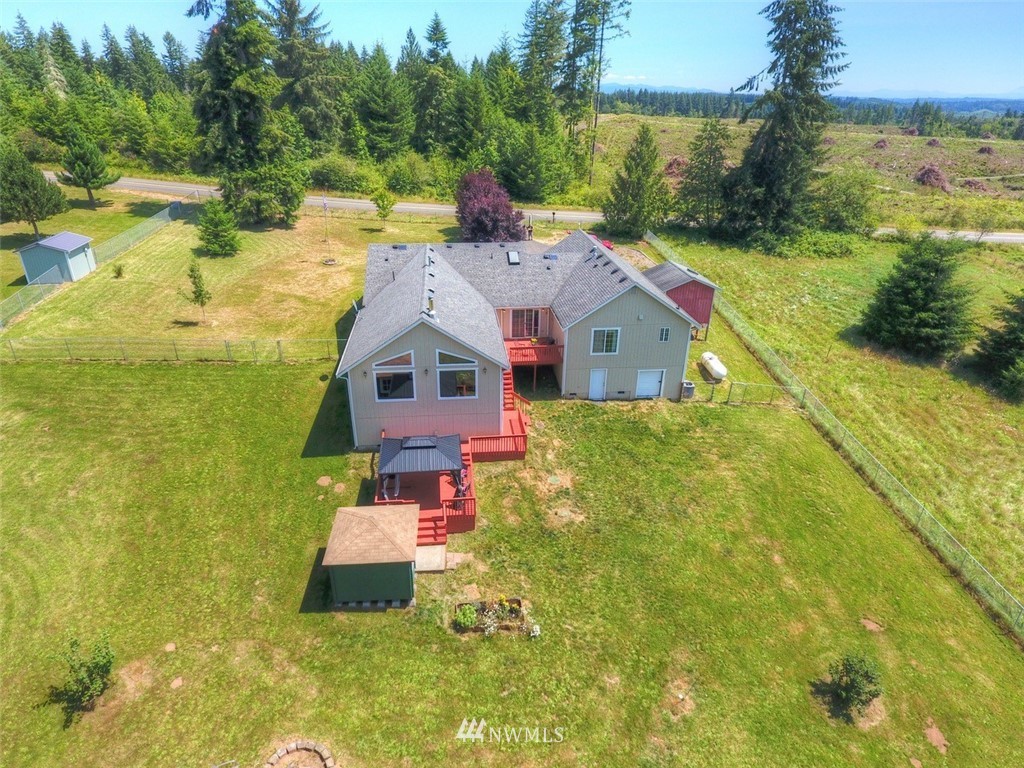 21741 Michigan Hill Road Southwest Rochester, WA 98579 - Photo 26 of 27 a aerial view of a house with a yard