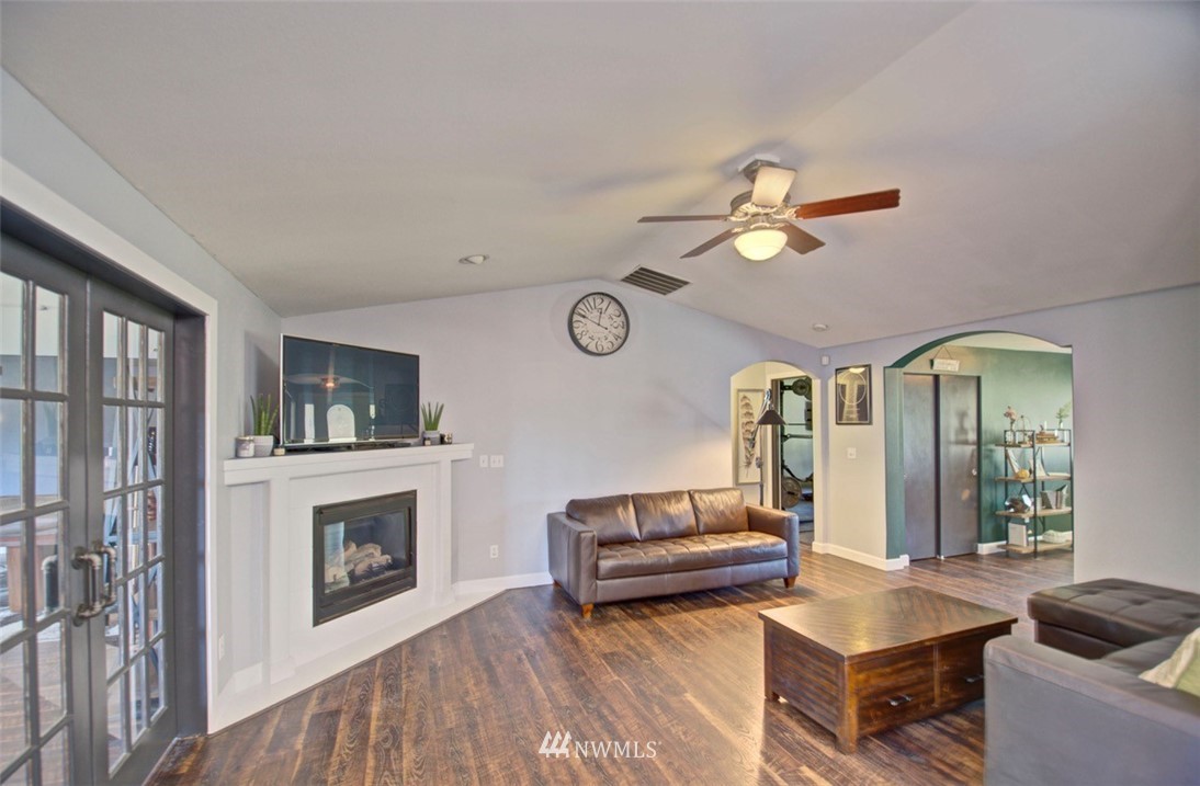 21741 Michigan Hill Road Southwest Rochester, WA 98579 - Photo 5 of 27 a living room with furniture and a fireplace